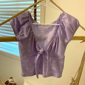 purple blouse with flowers and tie in the front. only worn once